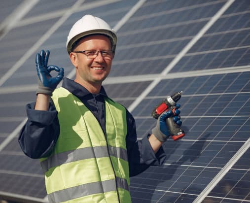 Solar engineer inspecting panels on site